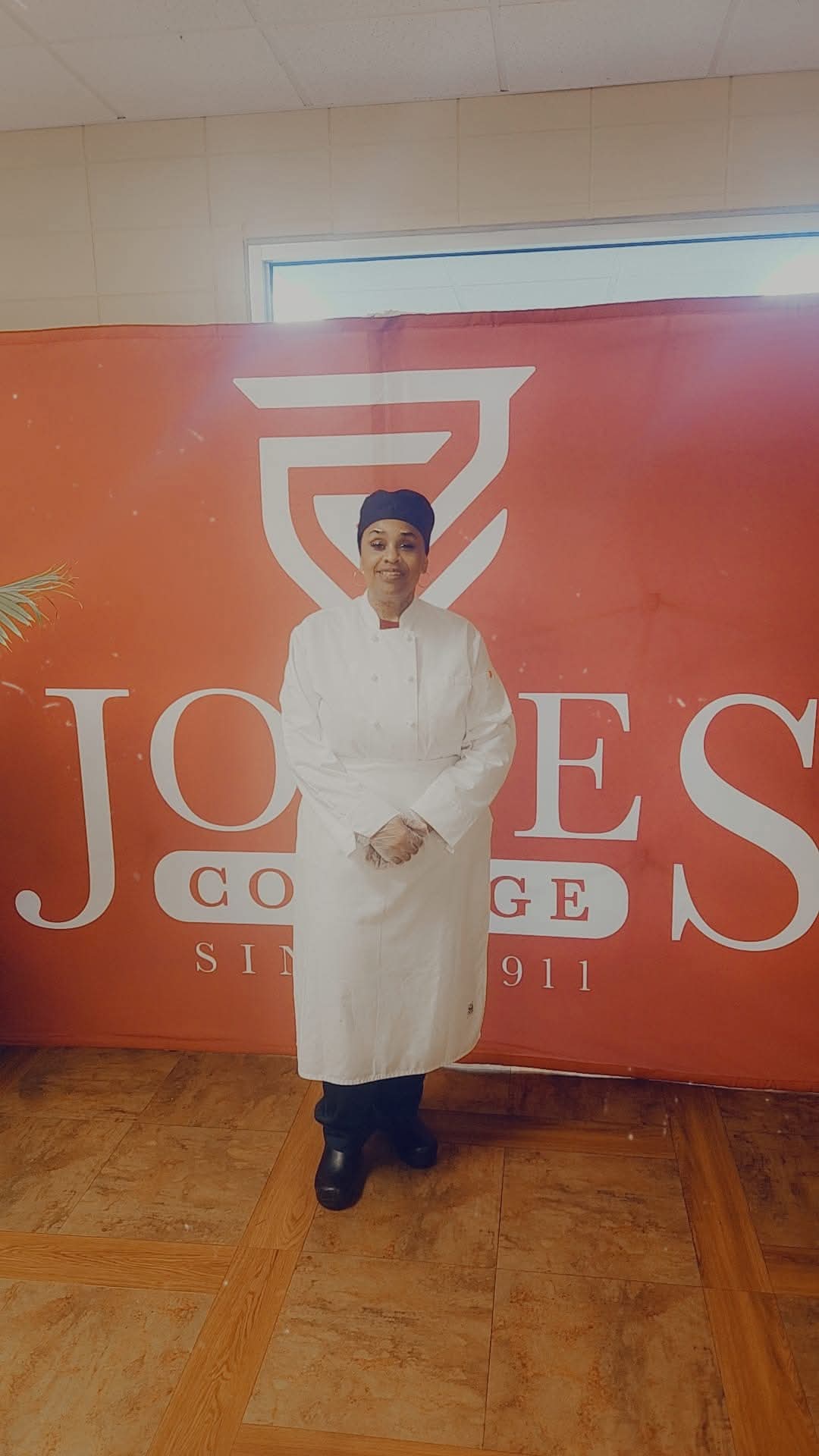 Chef standing in front banner